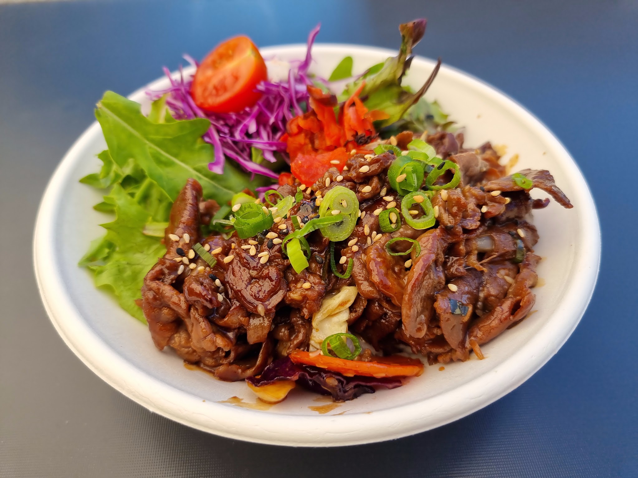Beef yakiniku rice bowl with fresh salad