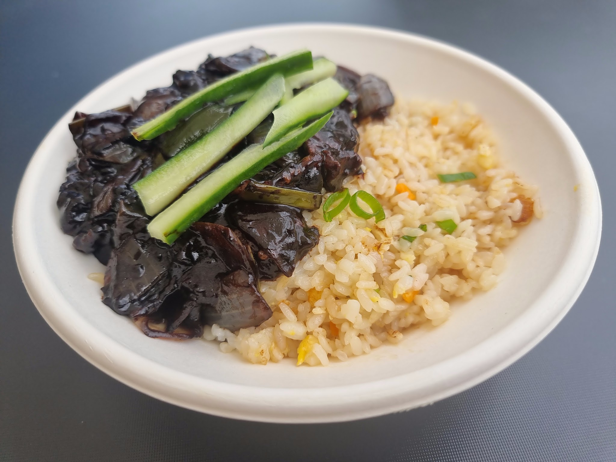 Black bean rice bowl topped with cucumber
