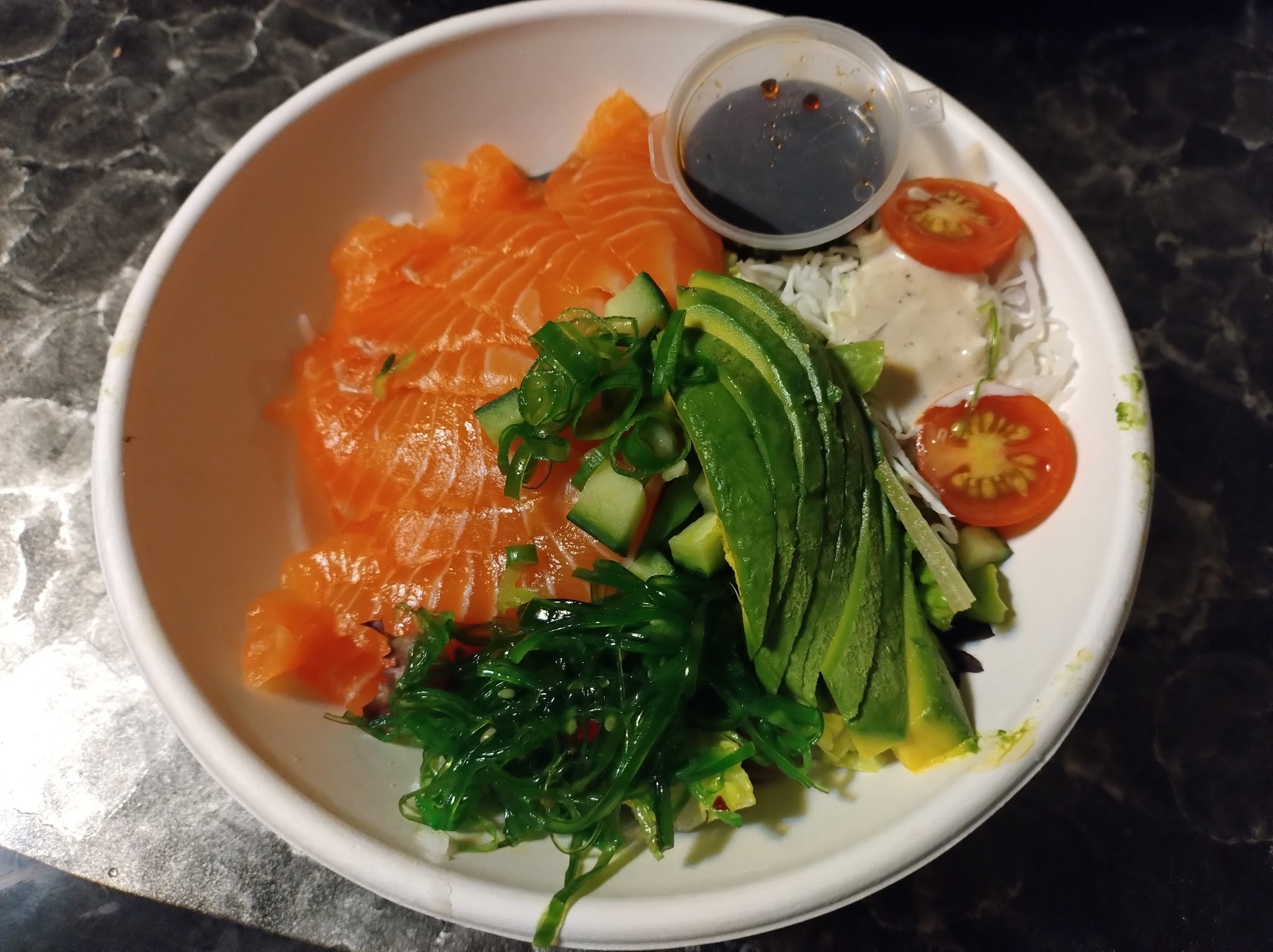 Salmon sashimi don with avocado and seaweed salad